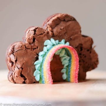 cloud-shaped brownie decorated with Airheads rainbow candy and blue buttercream frosting
