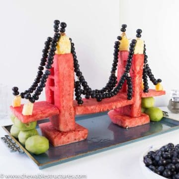 fruit tray ideas: golden gate bridge made of watermelon, pineapple, kiwis and blueberries