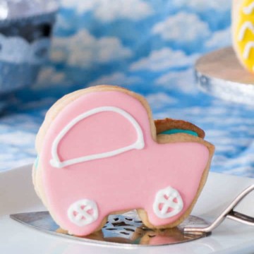 3-D sugar cookie shaped like a baby carriage