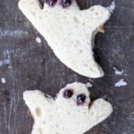 Halloween sandwiches shaped like ghosts made of peanut butter and jelly