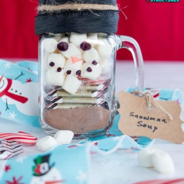 mason jar filled with snowman soup ingredients