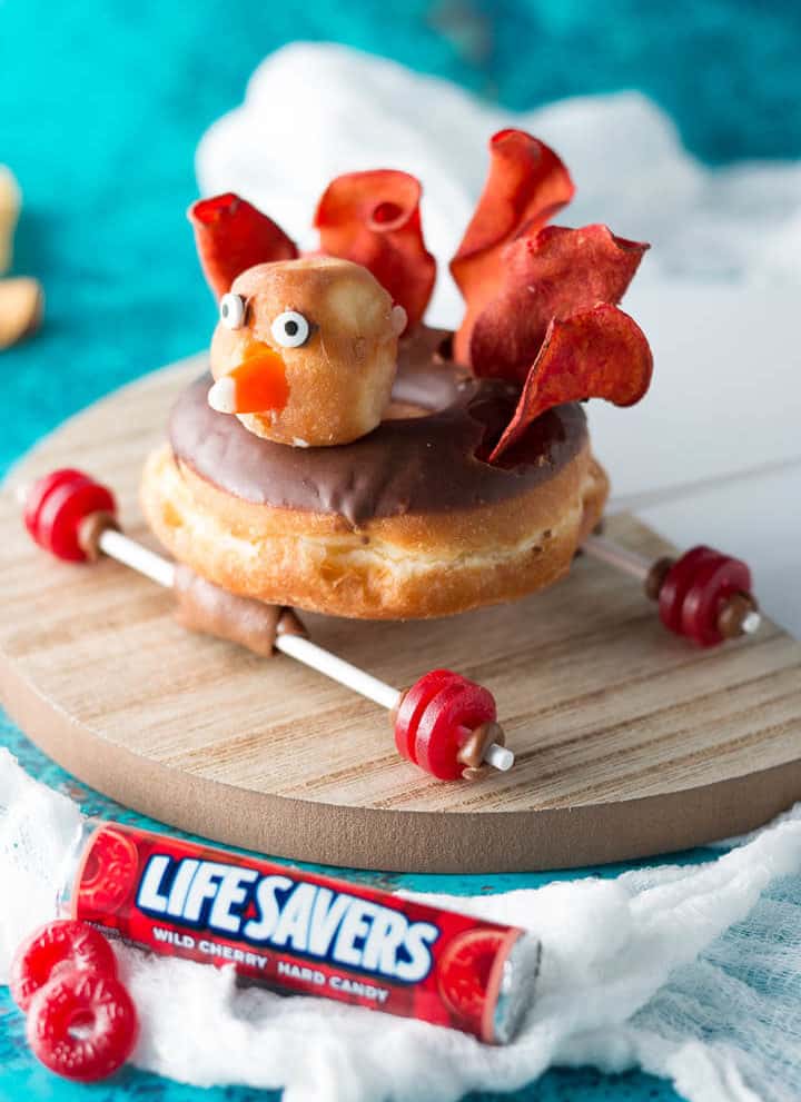 Thanksgiving Treats using chocolate turkey donut on a car frame with Life Savers tires