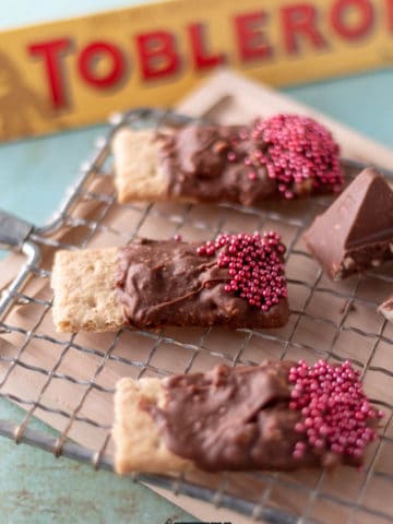 graham crackers covered in melted Toblerone chocolate topped with sprinkles