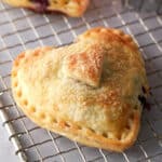 heart-shaped blueberry hand pies on a rack