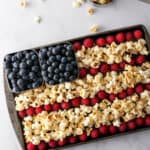 American flag made of popcorn, raspberries and blueberries